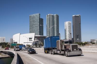 A truck travels in Miami. 
