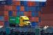 There are still differences of opinion among stakeholders regarding the equity of the proposed system for the ports of Los Angeles and Long Beach. (Above: The Port of Los Angeles.) Photo credit: Shutterstock.com. A truck hauing cargo at the Port of Los Angeles.