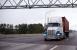 The number of hours truckers may drive is getting more attention from Congress, but do bills calling for reform, or the overturn of the electronic logging device mandate, stand a chance this year? Photo credit: Shutterstock.com. A truck travels on a US highway.