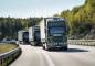 A convoy of Scania trucks rolls through Europe.
