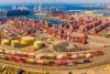 The labor contract on the East Coast limits terminals to semi-automation of cargo-handling, whereas full automation is allowed at West Coast ports. Photo credit: Shutterstock.com.