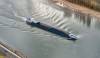 Barges on the Rhine are forced to carry significantly reduced loads because of low water levels. Photo credit: Shutterstock.com.